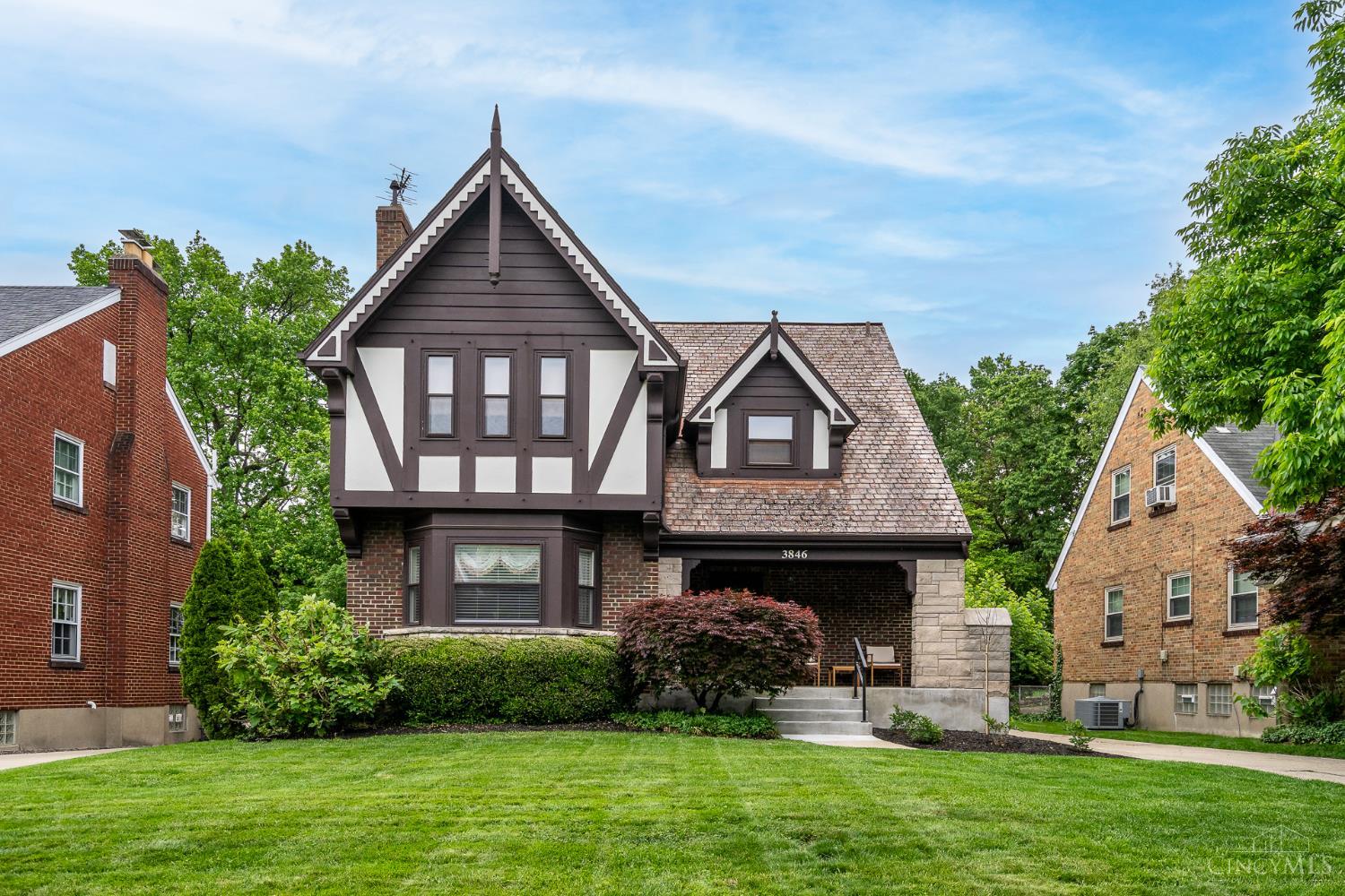 Charming Tudor-style home offering 3 bedrooms and 2.5 baths, blending classic character with everyday functionality. Inside, you'll find beautiful random-width oak hardwood floors and a wood burning fireplace that anchors the main living space. The eat-in kitchen features stainless steel appliances and ample room for casual dining. A convenient first-floor powder room adds to the home's practical layout. Upstairs, three comfortable bedrooms provide plenty of space, while the finished lower level offers a versatile area for a family room, home office, or recreation space. Step outside to enjoy the back deck overlooking a large, flat backyard, perfect for entertaining, play, or relaxation. Complete with a one-car garage, this home is a perfect blend of charm, space, and convenience. First Showings 5/8.