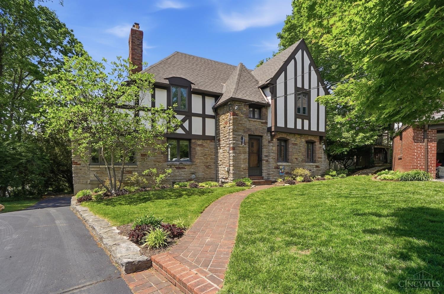 Sun-filled and immaculate English Tudor nestled in a quiet cul-de-sac just steps from the Square! Wonderful large level yard with spacious stone terrace- entry foyer - beautiful hardwood floors - eat-in equipt kitchen with breakfast room - lower level home office & full bath - 2 sided gas fireplace & 1st floor family room - oversized garage too! Leave offers open for 48 hours, seller reserves the right to accept an offer prior. No escalation clauses.