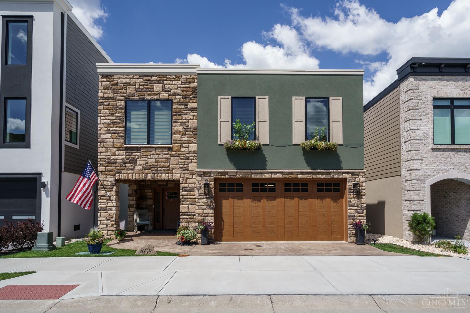 Only one year new and loaded with upgrades! Enjoy incredible river views from both private decks and experience approximately 3200+ sq' of luxury living in this thoughtfully designed home. The spectacular recreation room, spacious study, and expansive open-concept living area provide exceptional space for work, relaxation, and entertaining. The state-of-the-art kitchen features premium KitchenAid appliances, while immaculate hardwood floors and Pella windows add timeless quality throughout. The owner's suite boasts a custom walk-in closet and a no-curb walk-in shower for both style and convenience. Located in a desirable riverfront community offering a walking trail, dog park, and community fire pit, this home is just minutes from shopping, dining, biking , entertainment, and everyday essentials. 14 years of Unlimited Platinum Tax Abatement meaning you pay taxes only on the lot. Incredible savings! Exceptional Style!