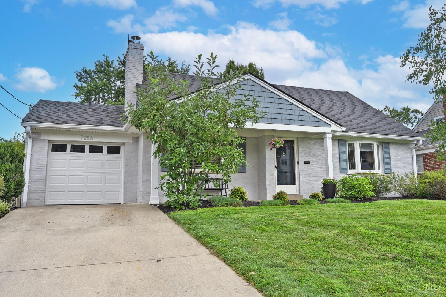 Welcome home to this beautifully updated Madeira 3-bedroom Cape Cod, with a rare first-floor primary bedroom. 1st floor has an office that could also be used as a 4th bedroom. Refinished hardwood floors flow throughout the main level, complemented by a stylish kitchen with granite countertops and LVP flooring. The living room features a cozy electric fireplace with custom built-in shelving-2022. Downstairs, the finished basement offers a spacious family room with a walkout, full bath, and new carpet, perfect for guests or extra living space. Enjoy outdoor living on the large rear deck overlooking a fully fenced backyard, plus a professionally landscaped front yard. Additional highlights: new roof (2023), all-new interior doors in bsmt-2025, and 1-car garage. Other updates: added flex room (could be guest bedroom or office, 14x8) & full bath in basement - 2025; basement waterproofed -2025; dual heating systems (Hi-efficiency furnace first floor and Heat pump on second floor); more!