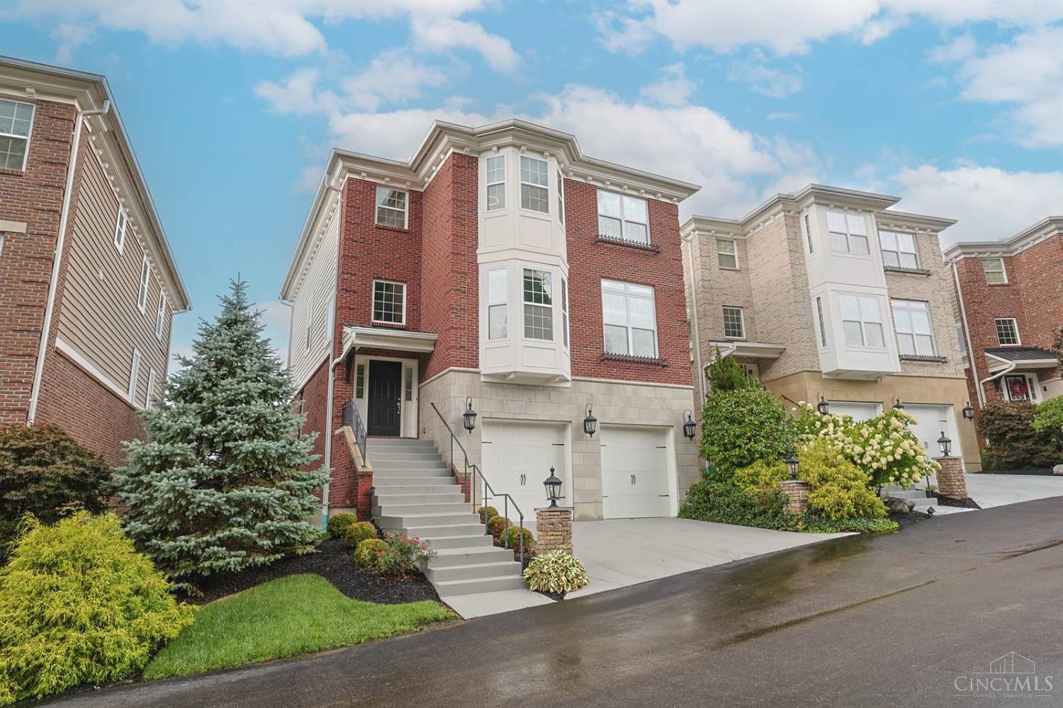 Welcome to the Views of Kenwood - Spectacular views especially at sunset. Conveniently located for a quick drive up the hill to Kenwood Towne Center or down to Mariemont town center. Well designed for entertaining with a beautiful kitchen open to the great room with a fireplace, wet bar and balcony. Lower level recreation/theater room with a second wet bar that walks out to a lovely fenced in yard with patio and fire pit. Spacious primary suite with private balcony, ensuite bath and 2 walk in closets. 4 bedrooms, 4.5 baths and a study. Geothermal HVAC. Tax abated - back to taxable in 2031, payable in 2032.