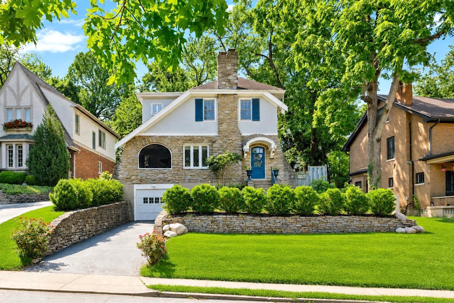 Timeless and updated Mount Lookout Tudor just two blocks from the Square! Beautiful hardwood floors throughout the entire home. Fantastic Living Room featuring arches, crown molding, Rookwood gas fireplace. French doors lead out to a charming covered side porch, complete with speakers, fan, and tv. Spacious Dining Room that has a nice arched opening to the Kitchen with counter seating between the rooms. The renovated Kitchen has newer appliances, granite counters, and walks out to the deck. Convenient Half Bath on first floor. Three Bedrooms and new Full Bath in 2020 with double vanity and large rainshower. All newer Windows. High efficiency Trane Furnace new in 2025. Study in lower level. Tiered deck with fire pit and shed. Prime location for walking to restaurants, coffee shops, Kilgour Elementary and Ault Park!