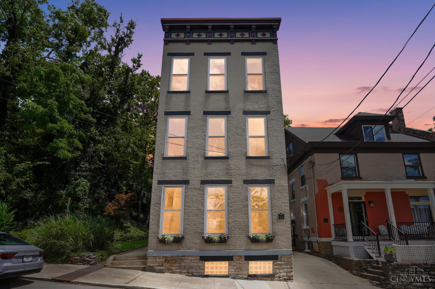 Meet The Queen of the Street, a stately 1875 beauty who has been turning heads for more than 150 years. Standing proudly three stories tall, she pairs historic character with a personality all her own. Her painted brick exterior makes a striking first impression, but step inside and her charm truly takes center stage. From her elevated perch on Walker Street, The Queen enjoys impressive views of downtown Cincinnati, while a park directly behind the home provides a rare backdrop of green space in the city. She's distinctive, full of character, and anything but ordinary. After all, when you've been commanding the street since 1875, you've earned the crown. Come see why this one-of-a-kind Cincinnati home is still reigning after all these years.