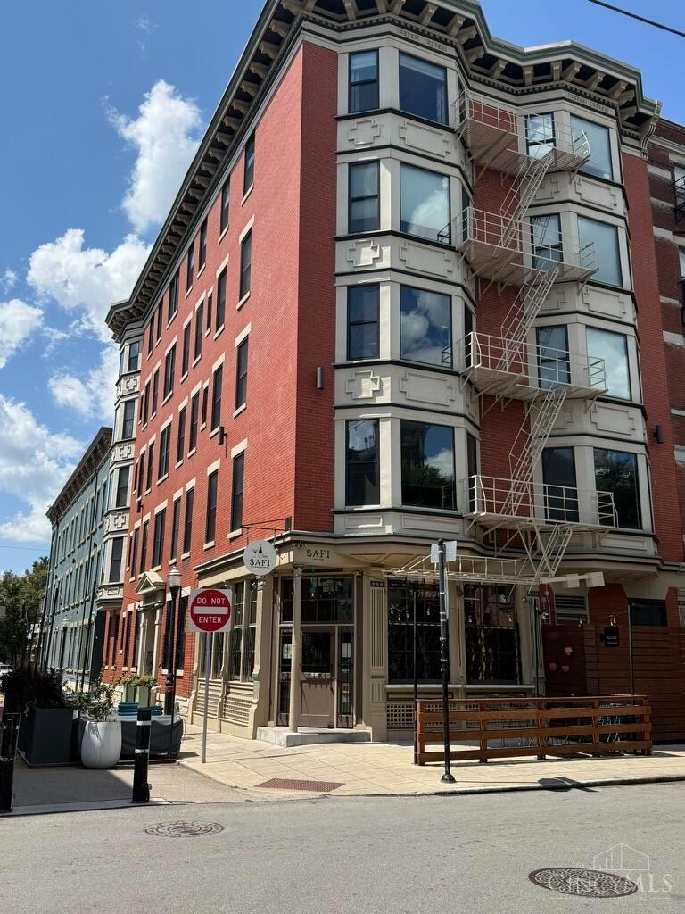 Contemporary OTR condo in a historic building with an elevator and fantastic rooftop view overlooking Washington Park and Music Hall. Completely remodeled in 2021 with high-end finishes, including Polyform kitchen cabinets, Miele and Bosch appliances, a Miele built-in coffee maker, and new floors, walls, ceiling, custom cabinets, and clothes closets. Additional room with a sleeper sofa and desk currently used for overnight guests. Located at the corner of tree-lined Republic Street, between Vine and Race Streets. Near Findlay Market, OTR dining, theaters, shops, Music Hall, Washington Park, and the streetcar. Make this your permanent home or city retreat. Seller has purchased another home in OTR, creating an opportunity to own this captivating condo in like-new condition.