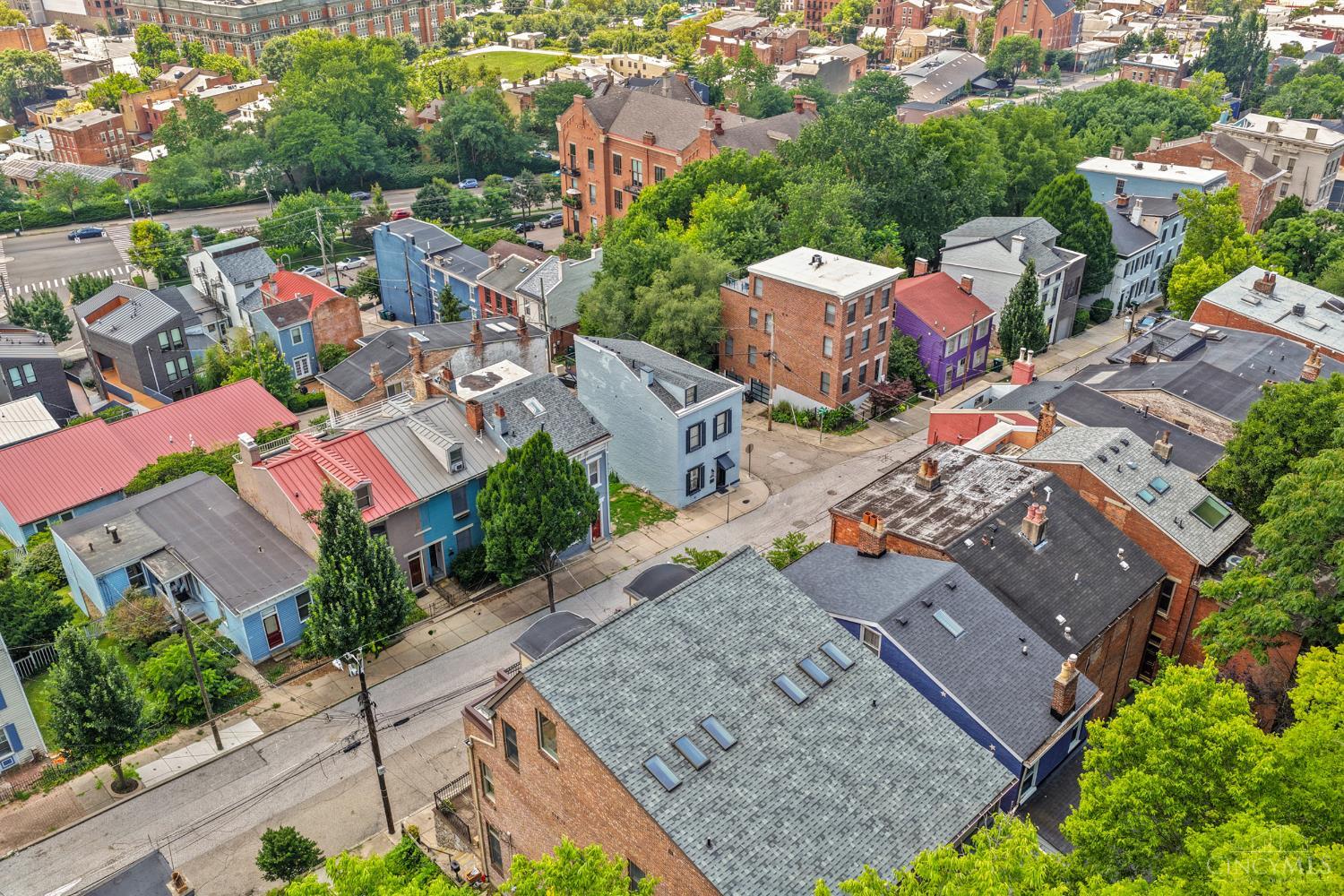 Historic home in desirable Prospect Hill, situated on the hillside above OTR! Beautifully remodeled 1880 home offering 2,186 sq ft. 2nd and 3rd floor balconies provide breathtaking city VIEWS! 10 ft ceilings and exposed brick in the spacious Living Room. Bright white Kitchen featuring granite counters and island seating. Fantastic Owner's Suite: fireplace, 2 closets, jacuzzi tub, sitting room and laundry! Patio and gated parking for 2-3 cars. Walk to restaurants, Findlay Market, street car, Ziegler Park and more!