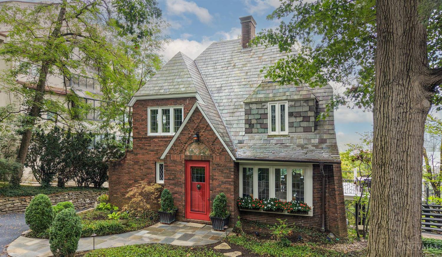 Beautiful home with spectacular Ohio River views and stunning sunrises! Character and charm abound, with large windows and original boxwood-panel hardwood floors in the living room and foyer. Updated head to toe! The inviting living room features a fireplace with old world charm. Designer kitchen showcases Amish-constructed cabinetry, stainless-steel appliances, and central island. The primary bedroom features expansive windows on two sides, capturing beautiful views. A third-floor bonus room with a full bath creates a private rooftop suite. The lovely, top-grade composite deck overlooks the English-style garden, Ohio River, and East End. Ideally located near shops and restaurants, and just minutes from Eden Park, Mt. Adams, and downtown. No escalation clauses. Offers remain open for 48 hours. Seller prefers a closing as soon as possible.