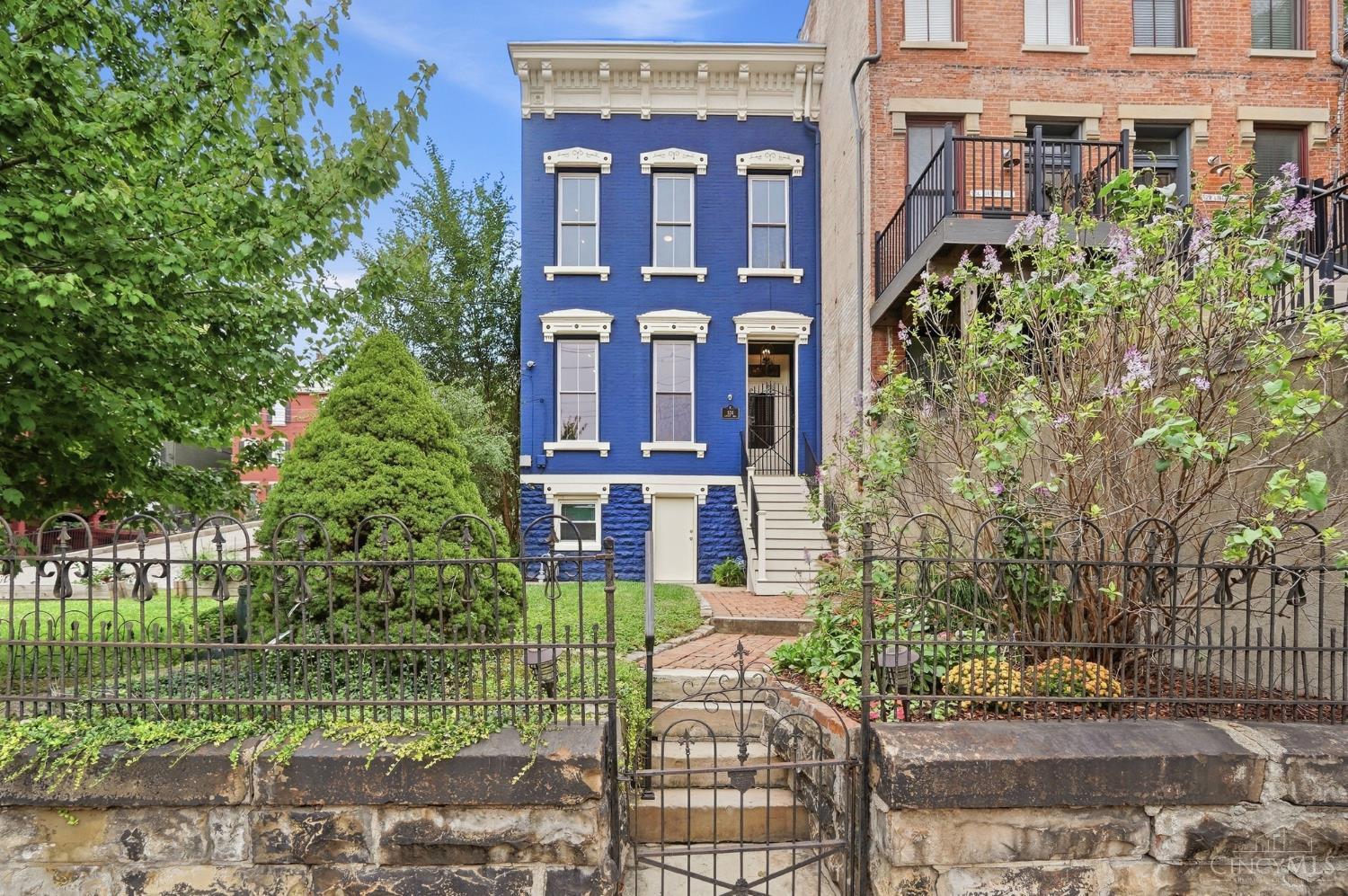 Historic Charm & Modern Comfort come together at 524 Liberty Hill! Built in the 1800s and thoughtfully restored in the 2000s, this Prospect Hill home blends historic Cincinnati charm with modern-day living. Step out your front steps and take in views of Downtown and iconic Music Hall. Inside, soaring 10-ft ceilings, exposed brick walls and 4 decorative fireplaces showcase the home's original character, while updated kitchen and baths provide modern comfort. The first floorwith kitchen, living room, dining room and half bathis perfect for entertaining. A nearly $100K third-floor renovation added a spacious 3rd bedroom, full bath and a study/rec room. Enjoy front yard space for kids and pets and a large rear deck for gatherings. A rare bonus - 2 adjacent lots may be available for an additional cost! Just minutes to OTR, Findlay Market, UC, hospitals, TQL Stadium and Downtown Cincinnati.