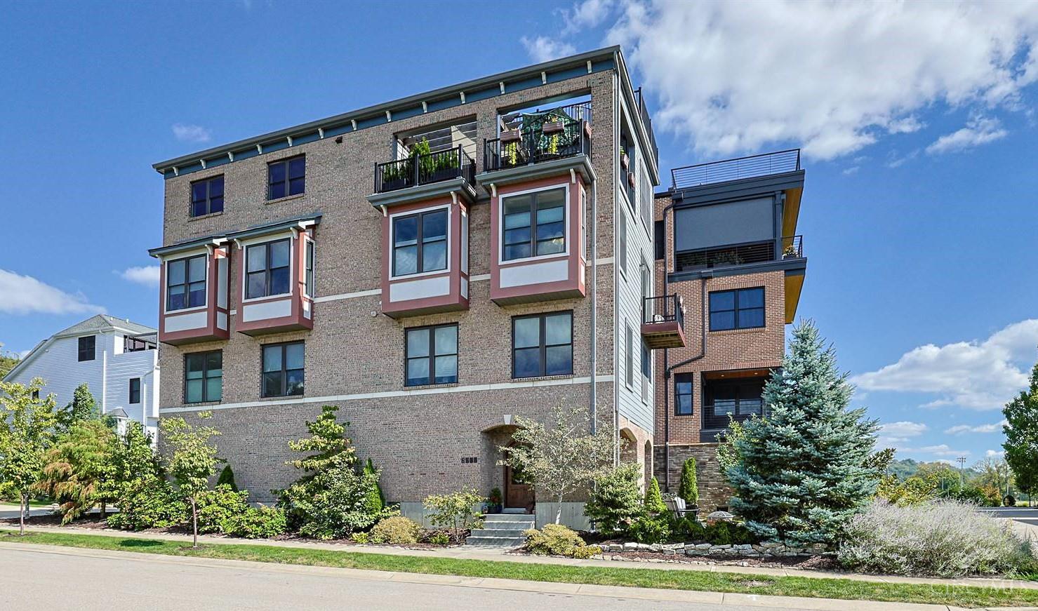 Experience elevated urban living in this stunning 2018-built residence with breathtaking river and city skyline views, LEED Platinum energy efficiency, solar panels, and a tax abatement through 2033. The flexible open-concept floor plan features a spectacular gourmet kitchen with oversized island, generous gathering spaces, and a 23' x 14' terrace. Enjoy panoramic views from the rooftop deck. The luxurious primary suite offers two walk-in closets and a spa-inspired bath with oversized shower, garden tub, and double vanity. An elevator provides easy access throughout. Parking includes a 2-car garage plus tandem 3rd space and a large 10' x 14' storage room. Ideally located just blocks from East End restaurants, coffee shops and bars, with easy access to the riverfront trail and future Oasis Trail. Exceptional views, outdoor living, energy efficiency and urban convenience.