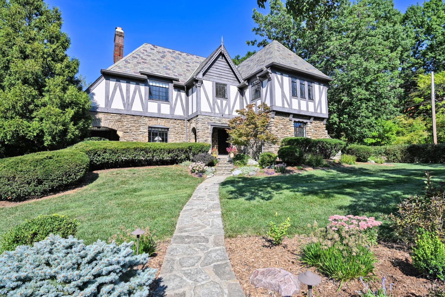 Charming Tudor in the heart of Clifton's historic Gaslight District. Built in 1934, this well-maintained 4-bedroom, 2.5-bath home features original character with modern comfort and amenities. Pegged hardwood floors, classic architectural details, two fireplaces and a slate roof. The spacious first floor offers a welcoming living room with a beamed ceiling and walkout to the covered porch, a  formal dining room, eat-in kitchen with granite counters and stainless appliances, and a beautiful half bath. Upstairs are four bedrooms and a full bath. The full basement walks out to the attached rear garage, additional  living space and storage, including a family room, laundry, full bath and mechanicals. Just steps from Ludlow Avenue's restaurants, shops and entertainment, with Burnet Woods, UC, Northside, Downtown and major highways nearby. A rare opportunity to own a classic Clifton home in an exceptional location. Sold before sent.
