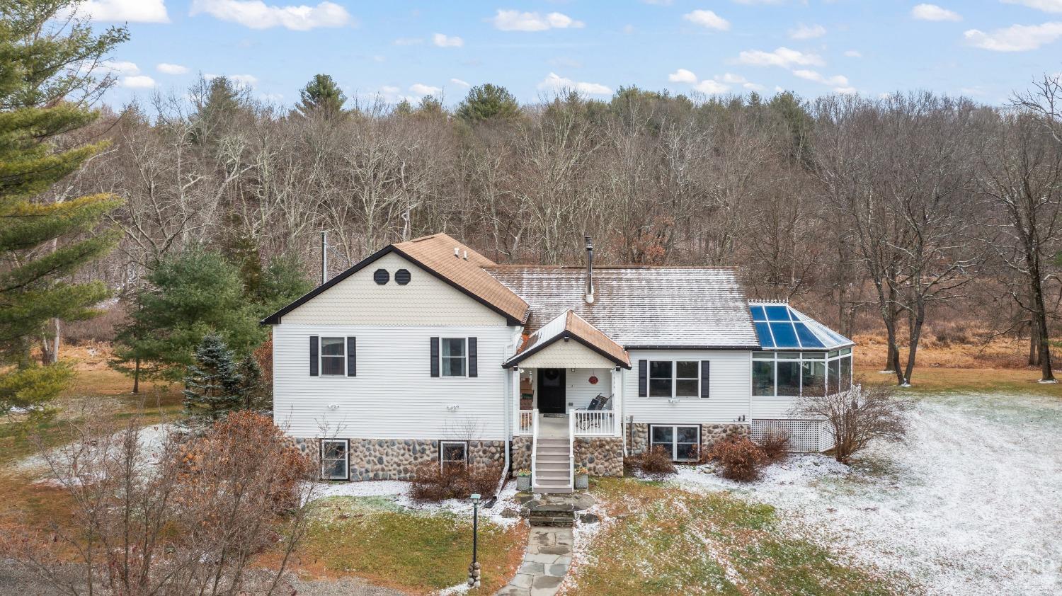 Welcome home.  This 3 BR + 2 bonus rooms and 2 BA ~3500 sf home is sited on 5+ acres.  On a private road, just off CR 7 in Copake, New York.  There is a full basement with walkout.  Property backs up to some wetlands and then a sizable  summer camp is beyond.  Well protected and private.