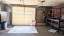 Inside the garage - paneled walls/indoor/outdoor carpeting 20262952