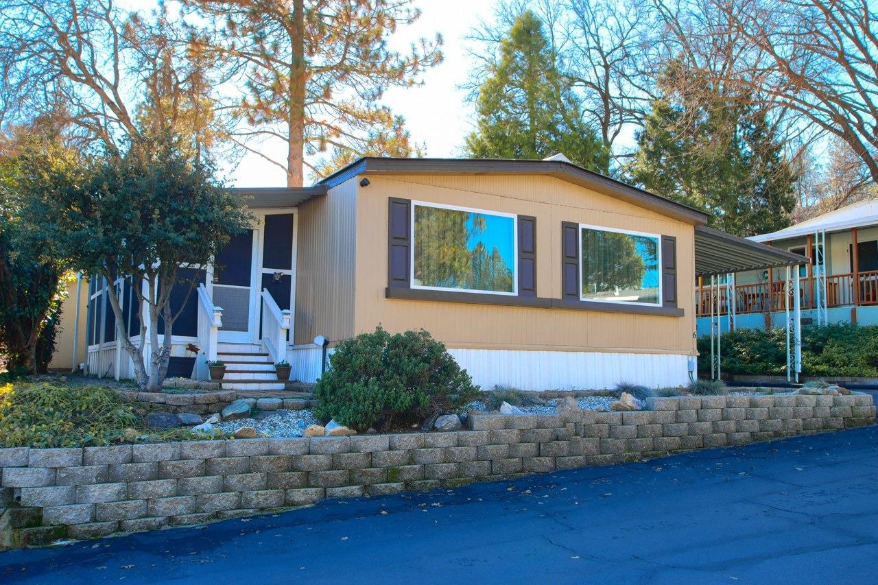 Come check out this beauty located in the 55+ Oakhurst Mobile Home Park, just minutes to town, shopping and great restaurants! The sellers have fully remodeled the home, remembering every little detail, from battery operated lighting, perfect if the electrical should go out to a fully remodeled main bathroom with a beautiful wood-sealed counter-top and unique sink. The home features 2 spacious bedrooms, 2 bathrooms with a large open family room and dining area right off the newly remodeled kitchen. Additionally enjoy the screened in sunroom porch area, perfect for enjoying the warm summer evenings, a quiet reading area, or also perfect for entertaining! The home also has a newly added HVAC system with forced air heat and air conditioning. T