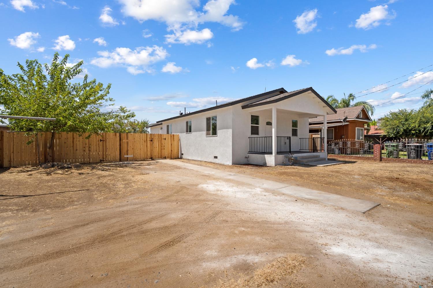 This 3-bedroom, 2.5-bath home is a fantastic opportunity for families or investors seeking passive income. Recently refreshed, this property features stylish laminate floors throughout, with brand new carpet in the bedrooms. The new windows and fresh paint brighten the space, while the newly installed fence offers potential RV access, adding to its versatility. Though cozy, the living room provides a welcoming space for relaxation while seamlessly flowing right into the kitchen. The kitchen is a highlight, boasting quartz countertops, new cabinets, a convenient pantry, and a charming breakfast nook. A powder room for guests enhances the home's practicality. The master suite is complete with a walk-in closet, beautifully tiled shower walls, and a new vanity and fixtures in the full bath. Bedrooms 2 and 3 are connected by a Jack and Jill bathroom featuring dual sinks, a new vanity, and fixtures, making it perfect for kids. The large backyard offers potential RV access and features a delightful fruit tree, providing ample space for outdoor activities and gardening. Located within just 500 feet walking distance to Roosevelt Park. Whether you're looking for a family home or a smart investment, this property is sure to meet your needs.