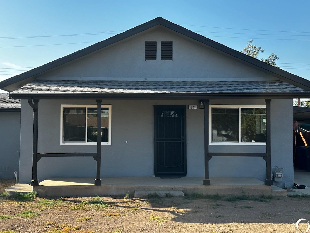 This beautiful fully-remodeled home is move-in ready. 3 bed, 1 bath 1,051 sq ft. home plus large permitted enclosed back patio Very large .29 acre lot Evaporative Cooling System, Forced Air Heating NEW: - Roof & gutters - Interior & exterior paint - walls and ceilings have modern, smooth finish - Remodeled kitchen with double stainless steel sink, quartz countertops, food pantry, lots of storage/cabinets with hidden garbage cabinet, plus slightly used microwave over gas stove/oven area. - Remodeled bathroom with new tub/shower enclosure, double sink with vanity cabinet mirrors, toilet, tile flooring, fixtures, lighting - Laminate flooring (Koa wood design) and baseboards throughout - Indoor laundry room with cabinet/quartz counter, ready for gas or electric dryer - Interior doors - Exterior front door and light - Windows/screens - Fans and recessed lighting - 12x16 ft. (192 sq ft) permitted, enclosed back patio with 2 doors and window for light. Insulated to keep cool in the summer and warm in the winter - Fully fenced front and back yard - Large jungle gym in back yard for the young ones to play - Small, open storage/workshop in back yard - Orange trees in back yard - Carport