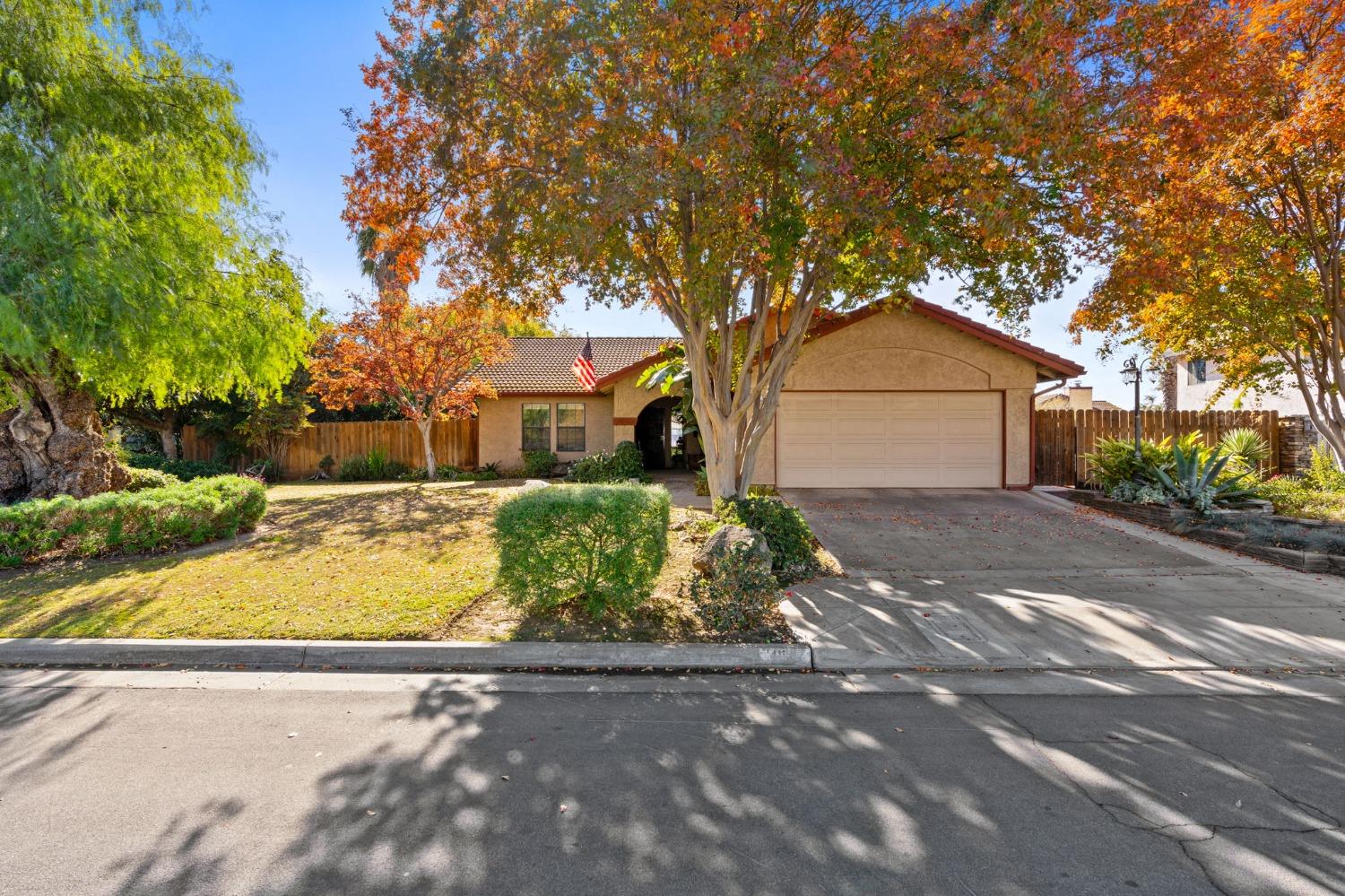 Charming Family Home in a Great Location!  Discover an ideal family haven in this delightful 3-bedroom, 2-bathroom home. This residence features an open floor plan perfect for family gatherings, with an airy living area that seamlessly flows into the dining area, conveniently located right off the kitchen. The kitchen boasts modern appliances, including a gas cooktop and granite countertops.  The master suite is a serene retreat with a spacious walk-in closet and an en-suite bathroom with access to the backyard. The additional bedrooms are generously sized and ideal for children or guests.  Step outside to find a large, fully-fenced backyard, perfect for hosting outdoor gatherings. This space is beautifully landscaped with a large pergola and various seating areas, offering the perfect spots for either a quiet corner retreat or a large party. One side of the yard is ready for your garden, already containing fruit trees, while the other side is a ready-made park area with trees and built-in benches.    Don't miss this opportunity to make this wonderful family home yours