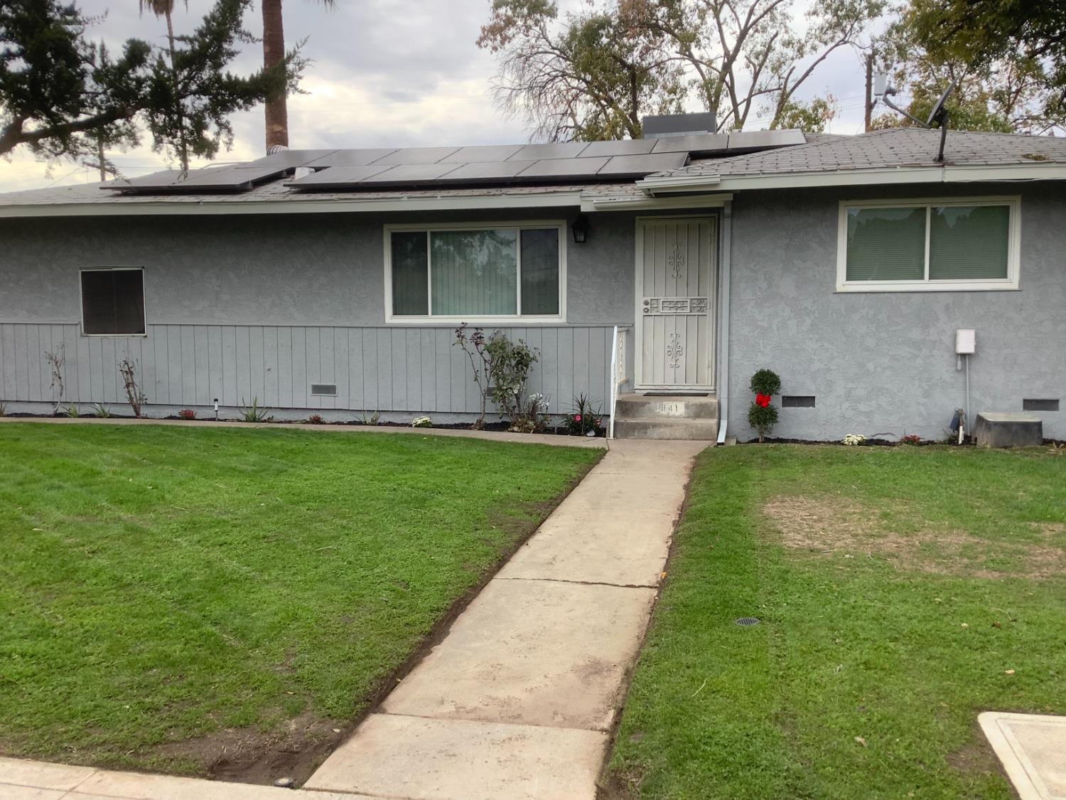 Welcome to this freshly updated 1950's traditional home. Located in the heart of Fresno, you will find 3 spacious bedrooms, 1.75 bathrooms, new kitchen cabinets with granite counter tops, large family room, updated tiled bathrooms with all new fixtures throughout the house. All rooms have either had the original hardwood floors refinished or have the new vinyl plank flooring.The bonus to this home is the huge room off the kitchen, which has potential for many uses. Maybe a game room, second family room or a big play room for the kids.Other great features include, leased solar, large back yard, extra parking and lots of storage space.This property truly feels more spacious than it shows, making it a great home to entertain your family and friends.Come check it out today.