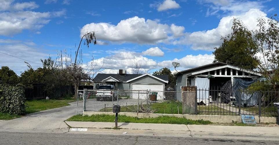 13330 E Young Avenue Parlier, California Great opportunity for first time home buyers or investors. Two homes on one lot. Both are currently being rented. Live in one and rent out the other! Tax records only show the 2 bed, 1 bath home, approximately 440. 2nd home is a 3/1 approximately 1000 sq ft. with a two-car garage. Storage shed. Spacious front yard.Buyer to verify square footage of lot and homes.Contact preferred lender- Gerald Hayes with Vero Mortgage at .