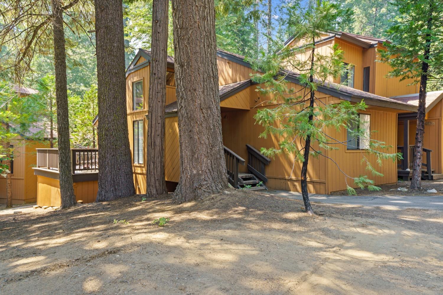 40750 Mill Run Lane 6 Shaver Lake, California Discover your mountain retreat in this beautiful 1-bedroom, 1-bathroom condo nestled in the serene, gated community of Shaver Lake, CA. This delightful home offers an inviting stone fireplace, perfect for cozying up on cool evenings. The spacious wrap-around patio provides an ideal spot for outdoor relaxation and entertaining, with ample room for seating and enjoying the picturesque surroundings. There is a loft area that can fit a full size mattress, while a Murphy bed in the dining room making this home hold 3 large mattresses. Step inside to find a modern kitchen equipped with sleek stainless steel appliances and a convenient breakfast bar, making meal prep and dining a breeze. The bathroom features an elegant tile shower, including a luxurious step-in shower for a spa-like experience. Located just 12 minutes from the lake, this condo offers the perfect blend of tranquility and convenience. Residents of this exclusive community enjoy quick access to a spa. With its combination of comfort, style, and amenities, this condo is the perfect mountain getaway or year-round residence. This home can also apply for a short term rental. Don't miss your chance to own a piece of paradise in Shaver Lake!
