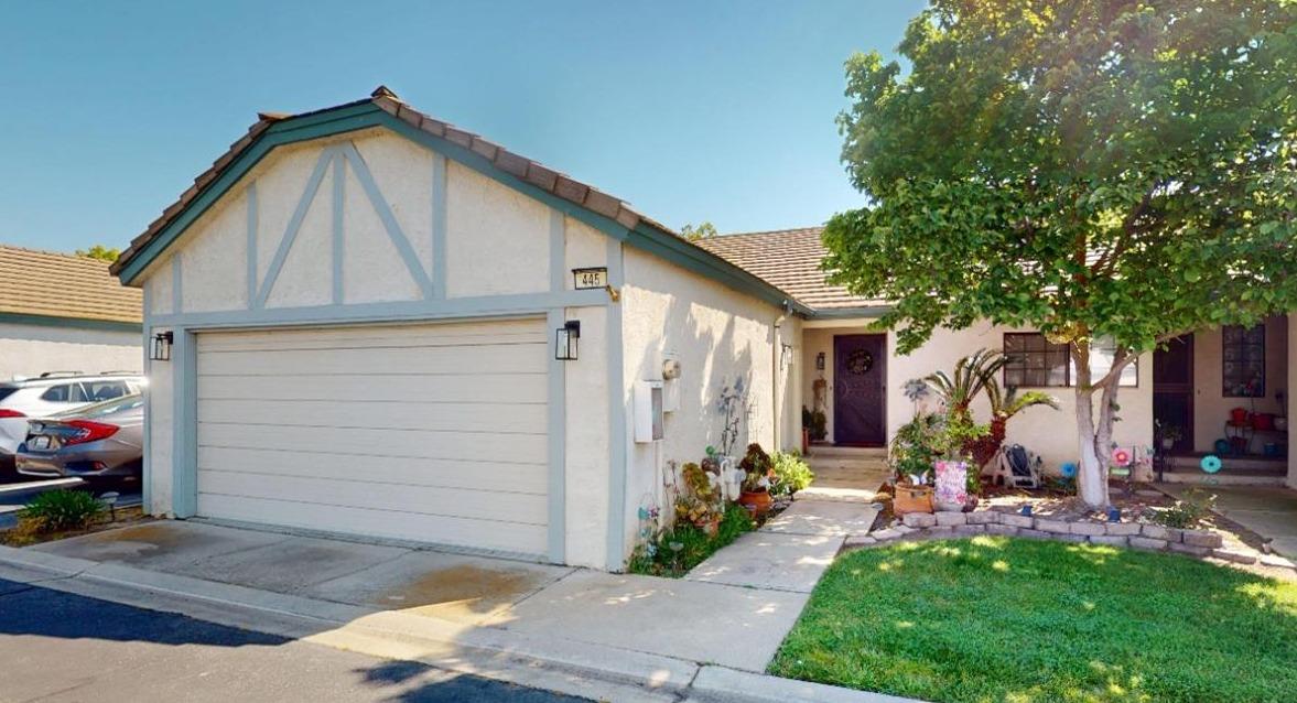 445 Quill Lane Clovis, California Immaculate property in a private gated community offering two bedrooms, two bathrooms, a 2-car garage, and 1273 s/f of living space! Do not miss your opportunity to take advantage of this rare opportunity with zoning for the highly desirable Clovis Unified School District! This beautiful home exudes pride of ownership throughout offering a gourmet kitchen with updated granite counter tops, a beautiful backsplash, a contemporary stainless steel sink (with a recently updated faucet), ample storage, a large breakfast bar, and a good-sized pantry. The large free-flowing living room boasts soaring vaulted ceilings with two stunning wood beams, a cozy red brick fireplace, a custom built-in cabinetry piece, and nice French Doors'' providing access to the private back patio. The spacious primary bedroom offers a private covered patio, room for an interior seating area, dual sinks, a great closet, extra built-in storage in the en-suite, and a convenient ceiling fan. Additional amenities include: a nice back patio area with adobe style'' floor pavers, a convenient pass through'' window from the kitchen to the back patio, a community pool & spa, gated entry and exit points for the community, steel security doors on all entry/exit doors to the home, a refrigerator, a clothes washer & dryer, and custom-built cabinetry/storage in the laundry area. Schedule your appointment today for a private showing today!