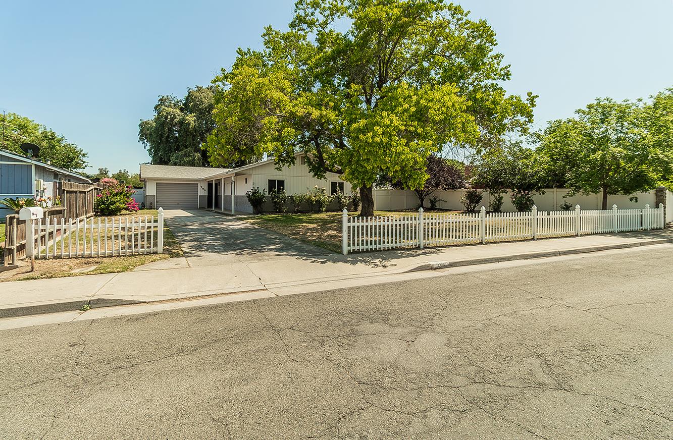 709 Keith Street Lemoore, California Welcome to this lovingly maintained single-family home, proudly offered on the market for the first time! Featuring 4 spacious bedrooms and 2 full bathrooms, this residence sits on an expansive nearly 10,000 square foot lot - perfect for entertaining, gardening, or future expansion. The classic white picket fence sets the tone, welcoming you into a freshly updated interior. Enjoy brand-new luxury vinyl plank flooring, plush new carpet, and a fresh coat of paint throughout, creating a bright and modern feel while preserving the home's warm character. This home has been thoughtfully cared for over the years and is move-in ready for its next chapter. Whether you're a first-time buyer or looking for a quiet retreat with room to grow, this is a rare opportunity to own a home with heart, history, and space.