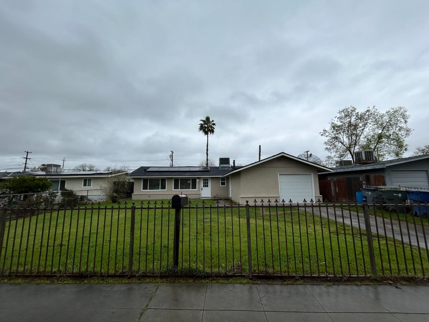 1223 E Drummond Avenue Fresno, California This home offers 4 bedrooms and 2 bathrooms, located on a generous lot. It has been thoughtfully renovated with New Cabinets, Countertops and New LVP flooring throughout. The interior and exterior have been Freshly Painted, Interior Includes New baseboards for a polished look. Both bathrooms have been Updated with modern fixtures, a new tub in Hall bath , and stylish tile showers. To enhance the home's brightness, new light fixtures, ceiling fans, and canned lighting have been added. Additional updates include New Rear fencing & New doors. A New roof, and a New Garage door for Added Curb Appeal! This home ensures Modern and Move-in-ready space.
