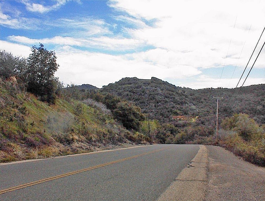 Own your own mountain! This is 10acres in 2 adjoining 5ac parcels that are the entire mountain. A drive takes you to the top of the mountain where there is a large pad area, a 30gpm well, a 2br1ba MH, and the most amazing views you will ever see from the most private setting on the mountain. This may be the perfect property. You have a full 360' view. To the north and east you look over the snow capped peaks of the High Sierras. To the south and west you enjoy panoramic views of the San Joaquin Valley and the coast Range over 100 miles away. The mobile is in good condition but has not been permitted. The pad area at the top is over an acre in size, so plenty of room for 2 homes if you want. This truly is an amazing one-of-a-kind property.