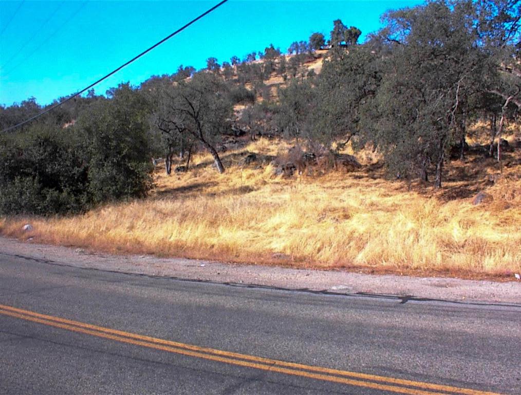 Viewed from the road this lot doesn't look like much. But first impressions don't always tell the whole story. This parcel has a nice bench area in it's center that is very buildable with gentle terrain. This naturally secluded site has great privacy and excellent local mountain views. The lot has a nice coverage of oaks and numerous rock outcroppings. Power is at the property line. This is a parcel that  you need to walk to appreciate. There's a lot here to hike. The seller is willing to consider carrying paper with an acceptable down payment and terms.