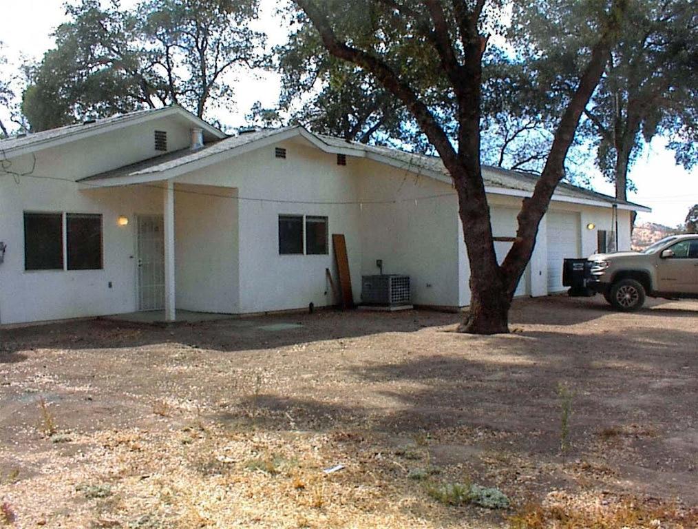 A true diamond in the rough''. This is a great opportunity for someone looking for a newer custom home and willing to handle a few minor fixer'' issues. This 2006 custom home has 1,554sf plus a 3 car sized garage. It has 2br2ba plus a den or 3rd bedroom. The home is near Hwy 180 on a great 5 acre parcel with plenty of usable land and an excellent 20gpm well. Terrain is nearly level in front and hillside at the rear. You have a great northern view of Squaw Valley. Don't let the pictures fool you. This is a great property, much nicer than it may seem at first.The energy efficient home is well designed with many extra features that make rural living much more comfortable. There is a 3700 watt owned solar system plus a built-in backup generator. The tankless water heater provides endless hot water. A freestanding wood stove in the living room reduces winter heating costs. The home has a built in vacuum system and the roof has a fire sprinkler protection system. The garage is a 2 car plus an area that has been plumbed for a mother-in-law unit with a separate entrance.This is an estate sale and the home needs a little work. The master bathroom and the kitchen need some finishing and the overall condition of the home is a bit ragged. An extended illness did not allow the original owner to complete her dream home, but all of the most important parts are in place and an astute buyer will see the inherent value. The property has been priced accordingly.