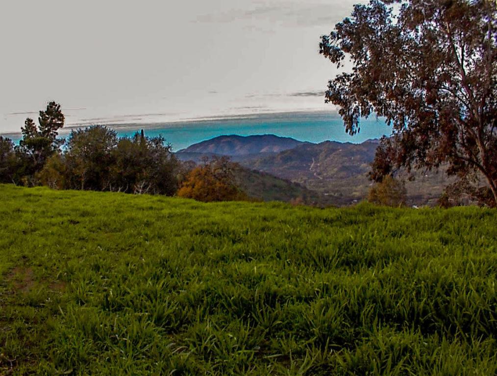 Unique developed hillside parcel with commanding northern and western views. This is a developed parcel with an operating well, active power, and a septic system that has not been hooked up. There are two very large pads, an upper and a lower, each with their own driveway from the street. The upper pad is close to the well and power service and enjoys terrific views with excellent privacy. The lower pad is larger with an older doublewide mobilehome that has never been placed in service. The home is in poor condition and the owner considers its value as primarily storage. The owner makes no claim as to its ability to be repaired for use as a home and has assigned no value to it. The septic was installed next to the home bu has never been hooked up. This pad also has awesome views with easy access to the street. Neither of the pads have a view of the other, so there is excellent internal privacy.This is one of the few developed parcels available where the pads, well, and electric have already been installed. The buyer can decide for themselves as to the flexiblity that exists with these features in place. The owner prefers a cash sale, but may consider carrrying paper with a substantial down payment and acceptable terms.