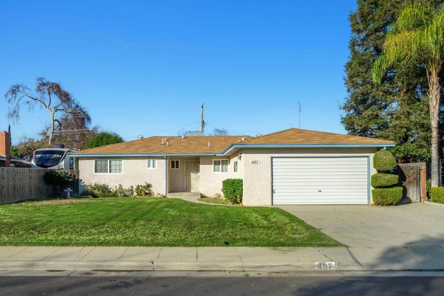 Clovis home with a versatile Bonus Room! This fantastic single-family home in the heart of Clovis, offers a blend of comfort, and functionality, highlighted by a spacious converted garage.