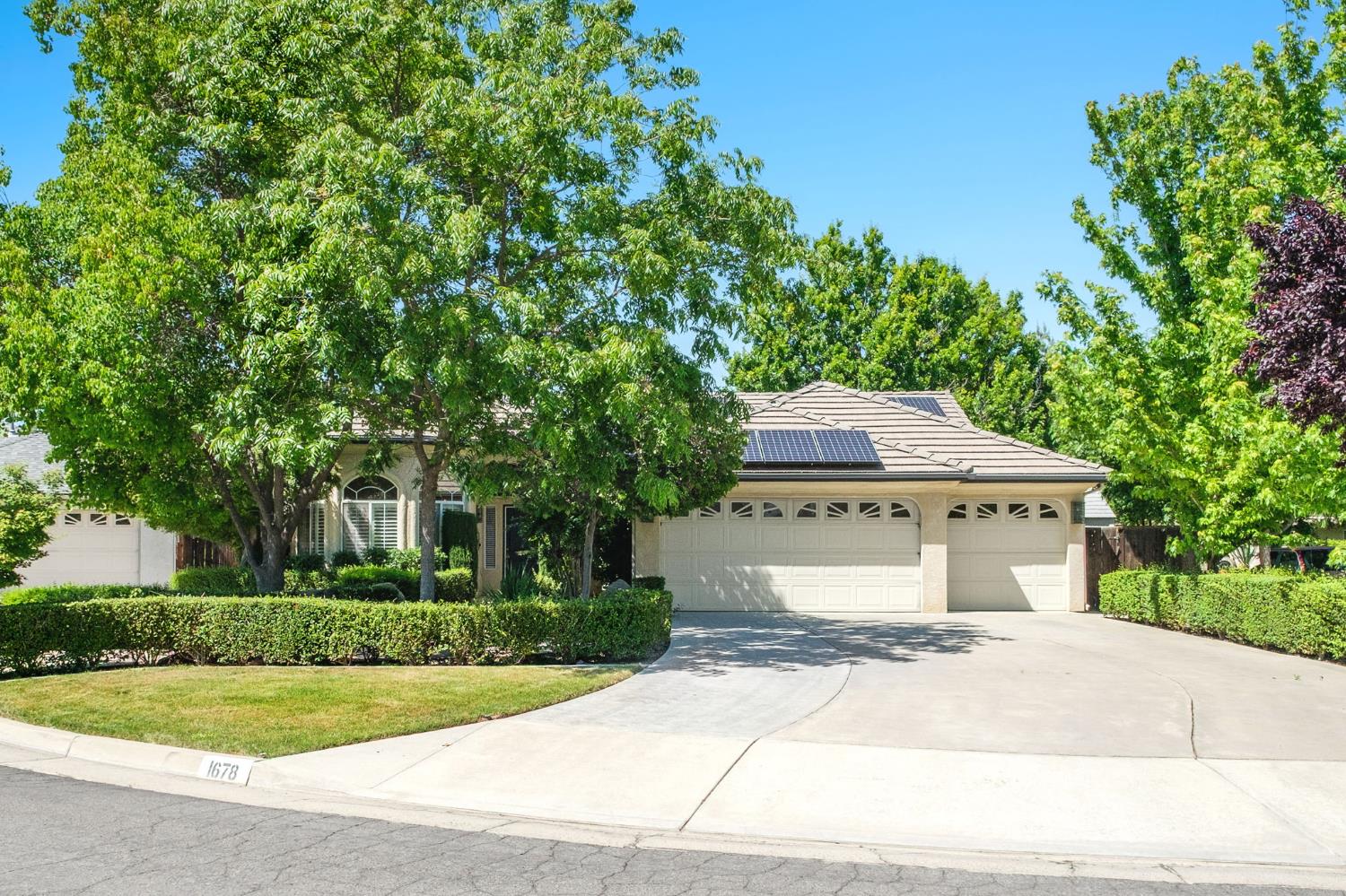 Welcome to your next home, where comfort, style, and location come together beautifully.Situated on a desirable corner lot in a peaceful cul-de-sac, this property offers both privacy and curb appeal. Inside, you'll find thoughtfully updated flooring with a clean, modern feel throughout. The kitchen features select appliances, including a gas range/oven (installed in 2020) with a convenient air fry option, perfect for everyday cooking and entertaining along with a functional butler's pantry that adds extra storage and prep space.The spacious primary suite boasts a remodeled bathroom complete with a soaking tub and a dual-sided fireplace, creating a relaxing, contemporary retreat.Enjoy year-round comfort while taking advantage of energy savings with OWNED SOLAR. Additional upgrades include a water heater installed in 2020, offering peace of mind for years to come.Step outside into your private backyard oasis, complete with a sparkling pool and lush landscaping, highlighted by a highly producing mature lemon tree. An extra concrete slab with electrical is already in place, making it ideal for a future above-ground spa. The side yard also includes a convenient storage unit for pool and garden supplies.Additional features include a spacious 3-car garage with built-in shelving, providing ample room for storage and organization.Located just blocks from Clovis West High School and conveniently close to River Park, Woodward Park, and a variety of dining and shopping options, this home offers both tranquility and accessibility.Don't miss your chance to own this beautifully updated home in a sought-after neighborhood.