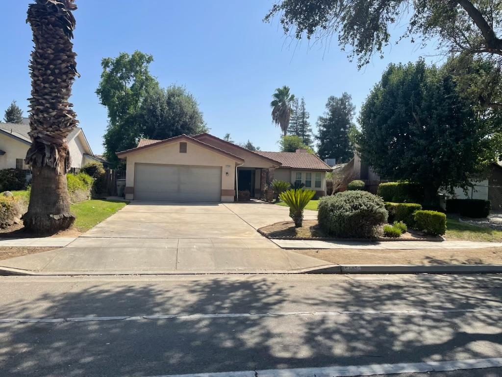 Charming Northwest home close to Fig Garden, featuring vaulted ceilings and an open-concept living room and kitchen filled with natural light. The kitchen offers new appliances, granite countertops, and a cozy eat-in area. Freshly painted with new carpet just installed, the home includes a spacious main suite with a large walk-in closet and a bathroom with dual sinks and a generous shower. Secondary bedrooms are nicely sized, with one also offering a walk-in closet. Inside laundry and a handy desk area make it perfect for a small home office or homework space. Ample linen storage and a good-sized yard with a large covered patio make it ideal for entertaining.Make your appointment to today to see this beautiful home.
