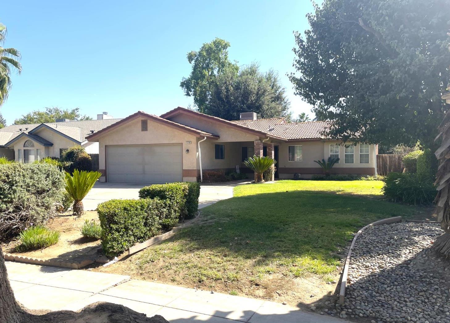 Charming Northwest home close to Fig Garden, featuring vaulted ceilings and an open-concept living room and kitchen filled with natural light. The kitchen offers new appliances, granite countertops, and a cozy eat-in area. Freshly painted with new carpet just installed, the home includes a spacious main suite with a large walk-in closet and a bathroom with dual sinks and a generous shower. Secondary bedrooms are nicely sized, with one also offering a walk-in closet. Inside laundry and a handy desk area make it perfect for a small home office or homework space. Ample linen storage and a good-sized yard with a large, covered patio make it ideal for entertaining The AC unit was replace 11/24.Make your appointment to today to see this beautiful home.