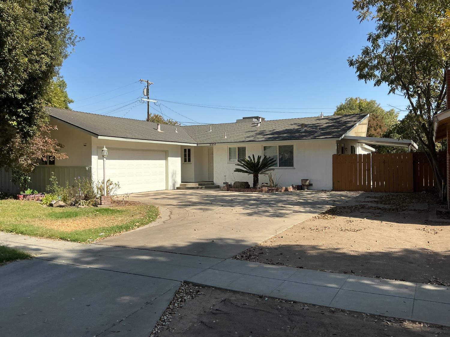 Freshly painted inside and outside. New luxury vinyl plank flooring and new carpet. Central Park Tract Home. Nice floor plan to enjoy  with a separate large living room and separate large family room! Kitchen with quartz counters, tile floor and eating area. Very convenient location with mature trees and established neighborhood. Nice size yard with patio cover, great for entertaining.Large side yard with gate may hold small trailer. Extra large driveway.