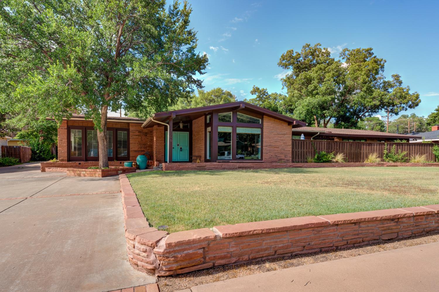 $15K Price Reduction on this Mid-Century modern masterpiece sure to impress; everybody that passes by is charmed by this Tech Terrace beauty. Rarely does such a special property become available on one of the most sought-after streets with a view of the park. Completely renovated in 2018; flooring, bathrooms, windows, window treatments, 7' privacy fence, soffit/fascia, new lighting, interior/exterior paint, kitchen w/subway backsplash & hardware, truly too many upgrades to list in this sophisticated luxury home. You'll fall in love as you open the double doors into a light & bright floor plan, captivating ceilings & finishes, cozy fireplace with secluded conversation area. Formal dining adjacent to a gourmet kitchen w/casual dining area. Spacious master suite w/spa inspired bath airflow tub, separate shower & his & her closets. Separate guest quarters; 4th bedroom & bathroom with full kitchen & washer/dryer. Walking distance to Roscoe Wilson, Hutch, & TTU; near medical district.