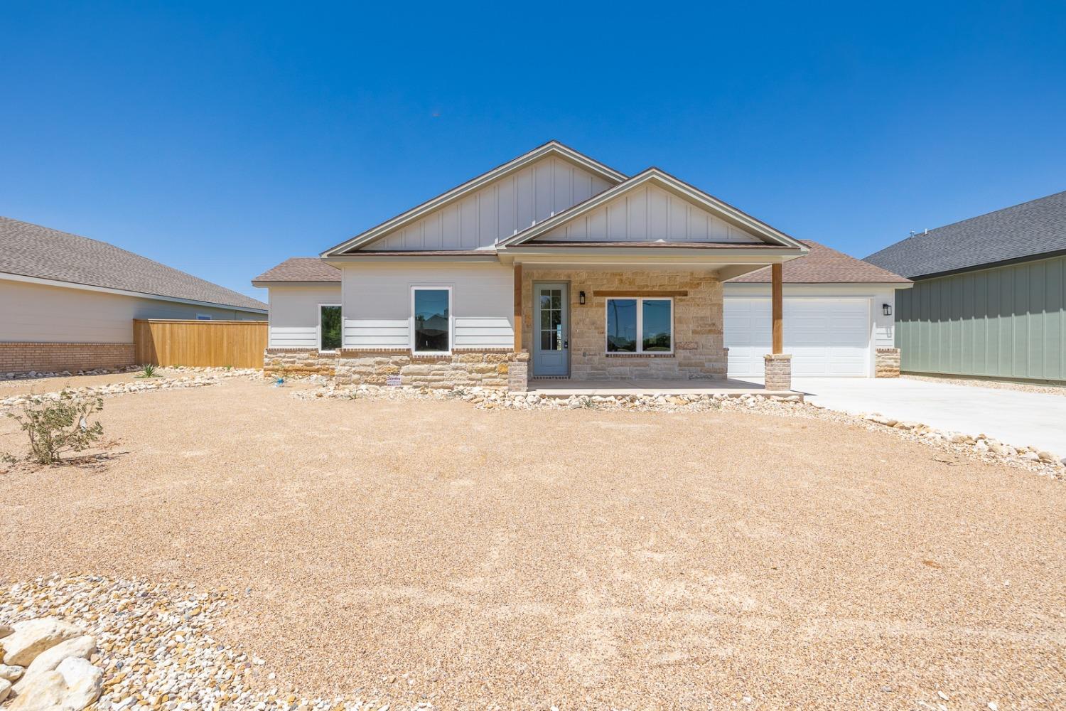 Charming 4 bedroom 2 bath home in Slaton!  Vinyl plank flooring throughout, stainless appliance package and a vaulted living room can all be found in this new home by J.M. Martin Custom Homes.