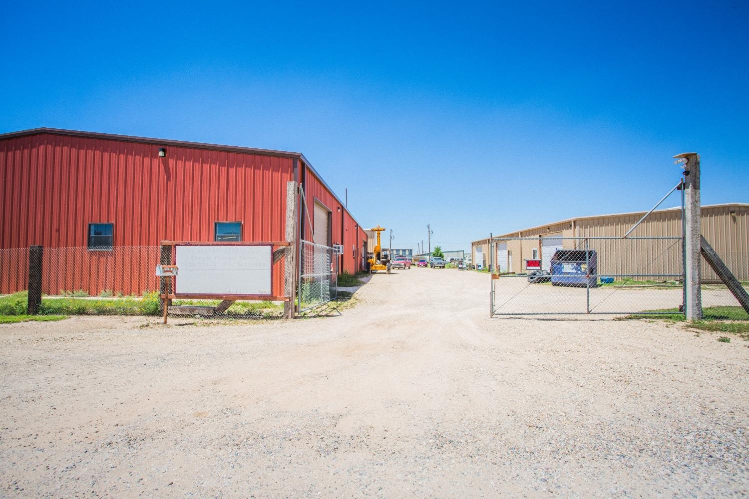 Great location, just inside the new Loop 88 and University Avenue, with easy access to I-27. Three buildings on this 2.02 acre tract. The main shop has more than 12,000 sq.ft and has a kitchenette and office area with granite countertops and desk space. The main shop has been a custom cabinet door shop for many years featuring a custom built vacuum system, with all equipment and machinery onsite to convey.    The two additional buildings (5400 sq.ft. each) feature a total of (6) six individual shops, currently leased month to month.