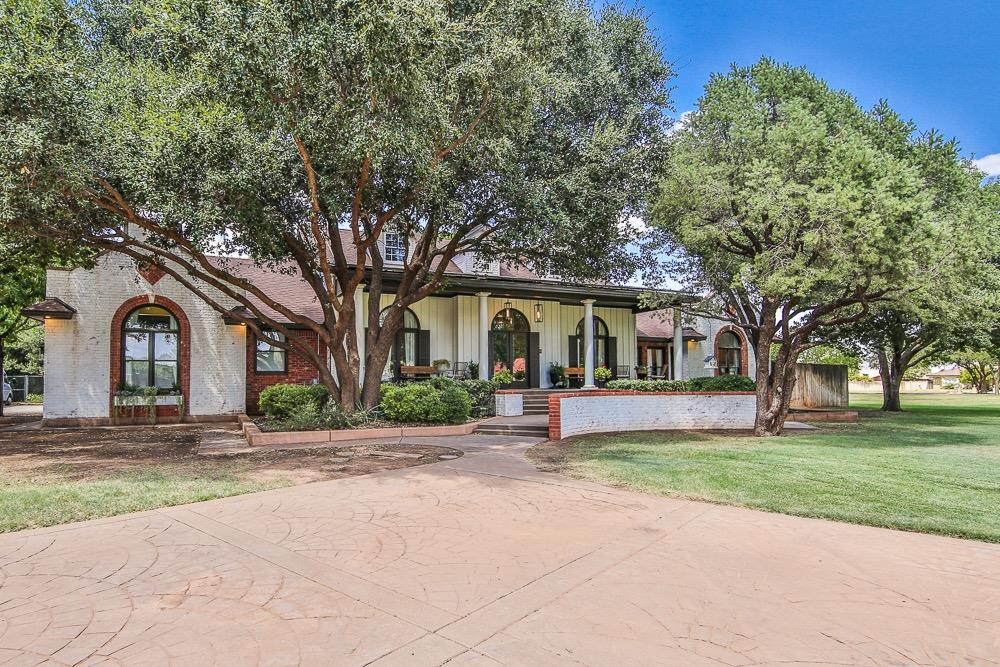 Fall in love with the charming southern-style porch of this Papalote Luxury home! From the minute you pull up to this mature tree-filled one acre lot, you will be captivated by all the attention to detail. As you enter, you will notice the designer touches throughout the home. From the tall ceilings and doors to the beautifully stamped concrete floors, to the immense windows and natural lighting and lovely crown molding, this home has it ALL! This 4 bedroom, 3 bath, 3 car garage home has an entertainers flow and is topped off by the 450 sq ft basement and loft library. This home was re-modeled in 2023 with all new upgraded appliances. Added perks are the extra parking, RV parking, rolling gate at the back of the property, newly purchased energy efficient air-conditioning units, solar panels installed in 2022, strong private well, new septic, 18 station irrigation system and tons of room for a pool! This home has more than can be listed. See it for yourself and will be AMAZED!