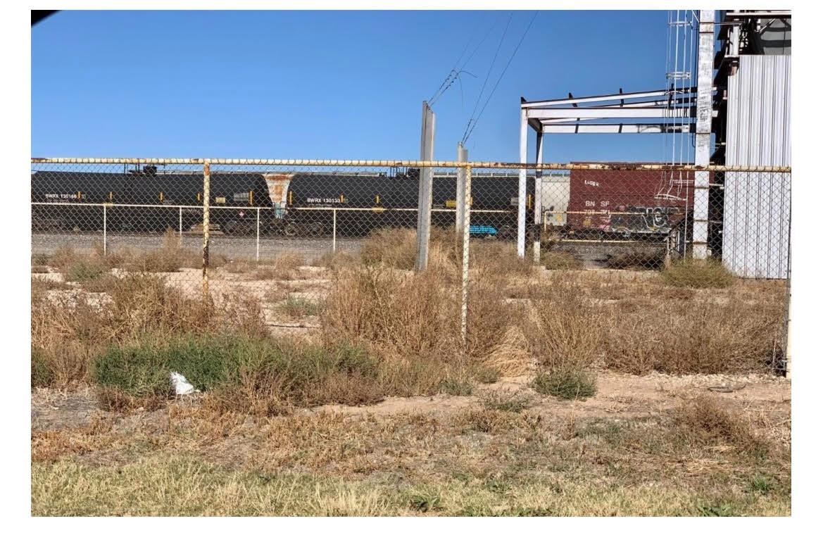 4 Commercial lots for sale in Slaton Texas. Great access to Industrial Blvd, railway access is just on the north side. 7 ft fence chain link encloses the gavel/rock base lots. A feed mill with one leg is located near the east boundary.