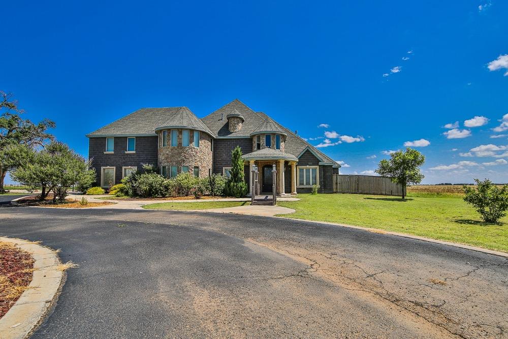 Stunning two-story home on 4.236 acres in the Idalou school district. This custom home offers a theatre room, office, second living/game room upstairs, garden area outside, plus 6 beautiful bedrooms. Call today to see this one of a kind property!