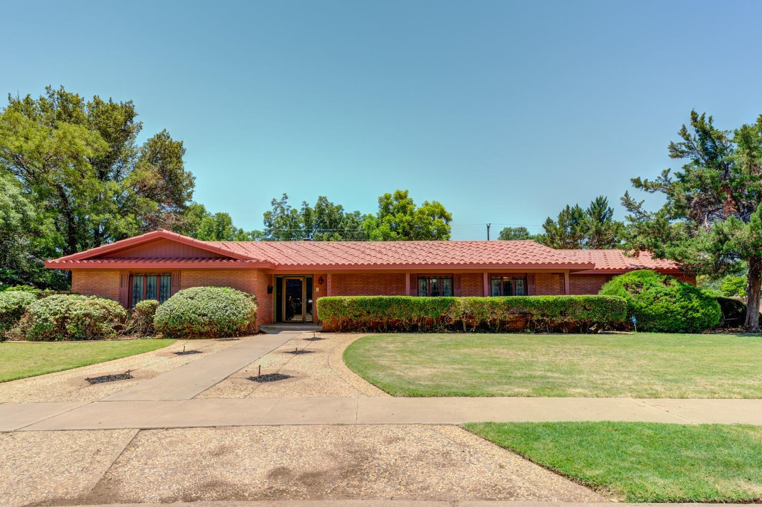A Mid-Century Masterpiece, Beautifully Maintained and Nestled in the Heart of One of Lubbock's Most Prestigious Neighborhoods. 3 Bedrooms, 3.5 Baths, 2-Car Garage w/ extra parking. A once in a lifetime opportunity to own a gorgeously authentic & luxurious 1960's home with top of the line craftsmanship & high-end touches throughout-terrazzo tile sweeps from the front door to the back, dazzling mosaic tiles, nearly flawless original wall-coverings, gorgeous cabinetry & special light fixtures sprinkled throughout. Large rooms, tremendous storage & sophisticated style- On a nearly 1/2 acre corner lot in Rushland Park, the most sought-after area close to downtown, Texas Tech & LCU and Lubbock's Medical District.