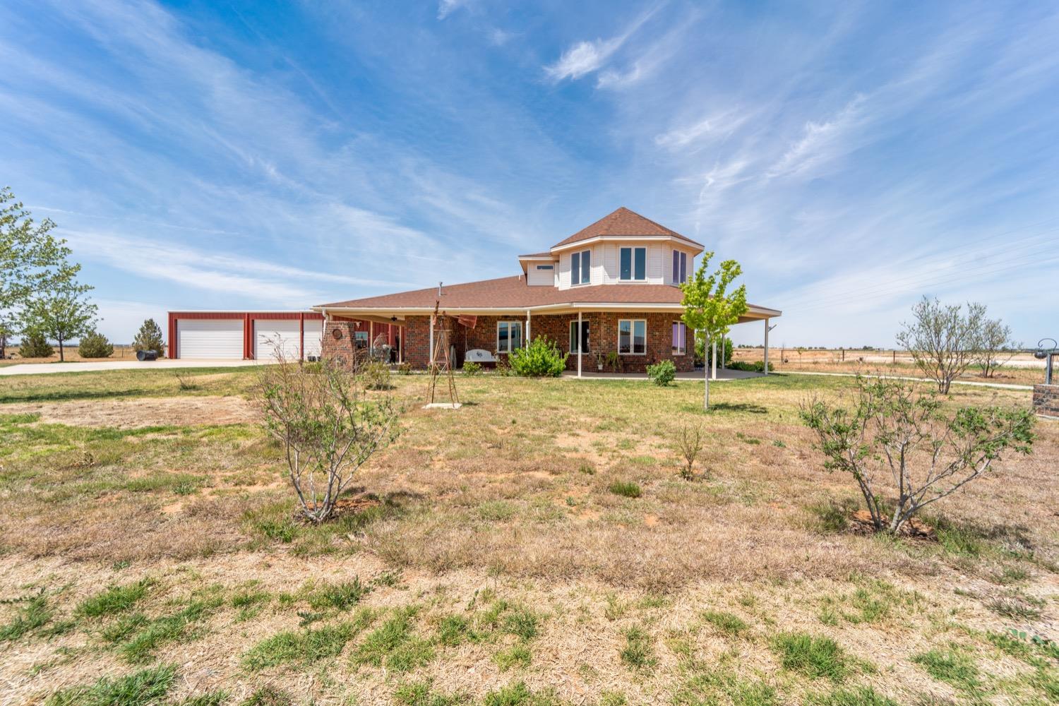Welcome to North University Ranchettes where you'll fall in love with this custom built home on 1 acre of land. Included are a total of 4 beds, 3.5 baths, a shop with a 4 car garage and gated access. The home was finished in 2018 and boasts a full wrap-around porch, a spray foam insulated main house w/3 beds, 2.5 baths and a 1,200 sf shop and 600 sf 1 bed, 1 bath apartment with laundry and kitchenette. The main house offers wood floors throughout, custom tile floors in the kitchen and bathrooms, with 36'' doors throughout and a easy access in the marble lined showers in both the house and apartment. The first floor has an open floor plan with a dual access isolated master suite, private guest suite and a gourmet kitchen. You'll enjoy the large island with seating area, a gas cooktop, all black stainless appliances and a KitchenAid Refrigerator that conveys. The 1-acre lot offers flower beds and irrigated raised vegetable beds, a well & septic. Schedule your showing today.