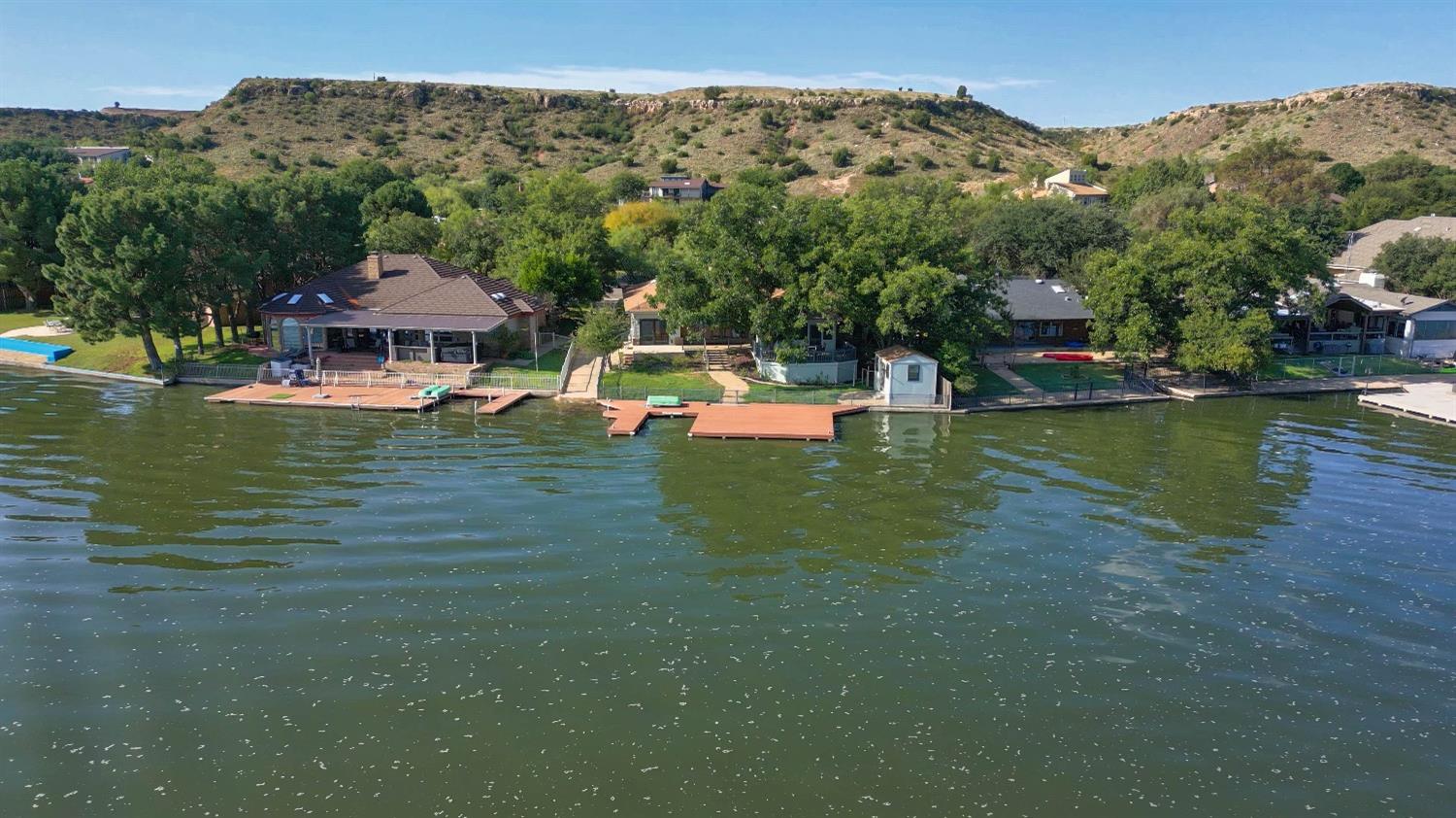 Welcome to your Lakeside Oasis!  Nestled in the heart of tranquility, this 3-bedroom, 2-bath home offers over 3,000 square feet of a rare opportunity to live in harmony with nature while enjoying the comforts of modern living. Located on the south shores of Lake Ransom Canyon, this property boasts breathtaking views of the glistening waters that compliment the West Texas sunsets.     The living room features a cozy fireplace, ideal for warming up on cool evenings while enjoying the serene lake view through large picture windows. Whether you're hosting a dinner party or preparing a quiet family meal, this chef's kitchen will inspire your culinary creativity. Just minutes away from Texas Tech, downtown, shopping, dining, and the Buddy Holly Hall. This property offers the perfect balance of serenity and convenience.  Don't miss your chance to own this slice of paradise. Schedule your viewing today and make this dream home your reality.