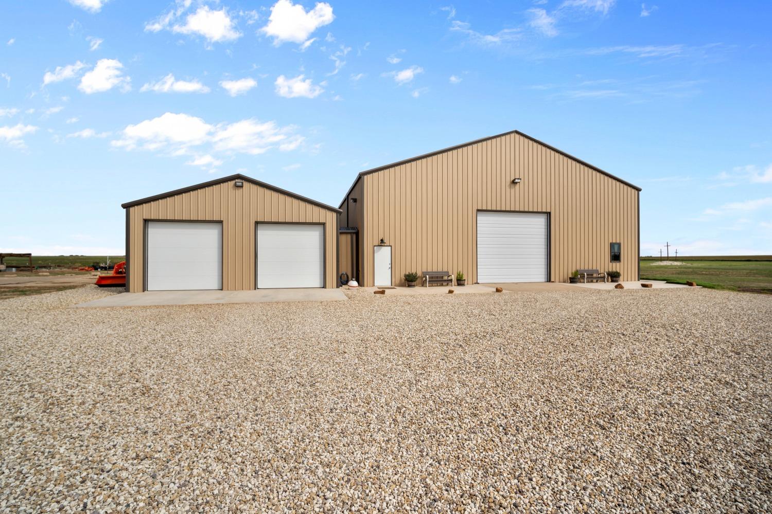 84 acres in the prestigious New Home School District on FM 211 with endless possibilities!!! The property currently has a 4,800 sq ft metal building (60 x80) plus a 30x50 garage. Both are heated and insulated. Living space blends a travel trailer with four additional rooms built by Trey Strong totaling 2 bedrooms, 2 full baths, 2 living rooms, and 2 offices: all are heated and air conditioned, with an adjacent laundry room. Outdoor space includes two pergolas, large gardens, and endless views. In addition, the property has 3 working water wells, high speed internet, and natural gas, plus a Generac Generator for back-up power. Options abound for residential development, farming or ranching, creating a venue, or building your dream house!