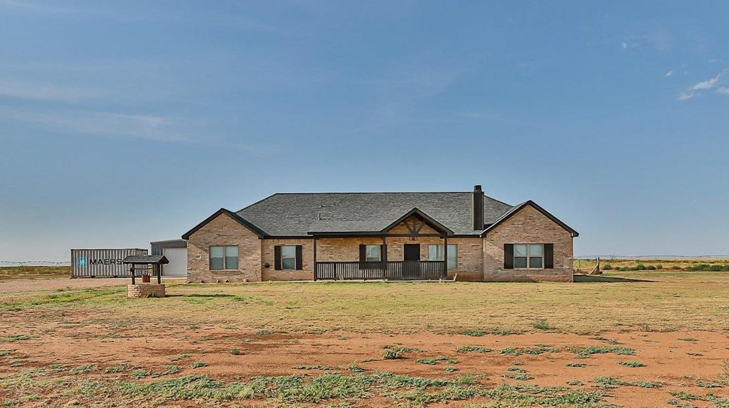 Now this is a steal of a deal! This stunning property offers a 4-bedroom, 3-bathroom ranch-style home with a 24 x 30 barn on 10.02 acres in the highly desired New Home School District. The open concept layout connects the living areas seamlessly. The kitchen features quartz countertops, a large serving island, stainless steel appliances, and a walk-in pantry. The living room boasts a special ceiling with center wood beam and corner fireplace. The master ensuite is isolated with double lavatories, a soaking tub, separate shower, and a wrap-around closet with built-ins. The laundry room is equipped with a sink, mudbench, and generous storage. A charming addition of a wood gate adorns the garage door. As you step into the backyard, you'll find extended concrete and a blank canvas, ready for your dream home to come to life.