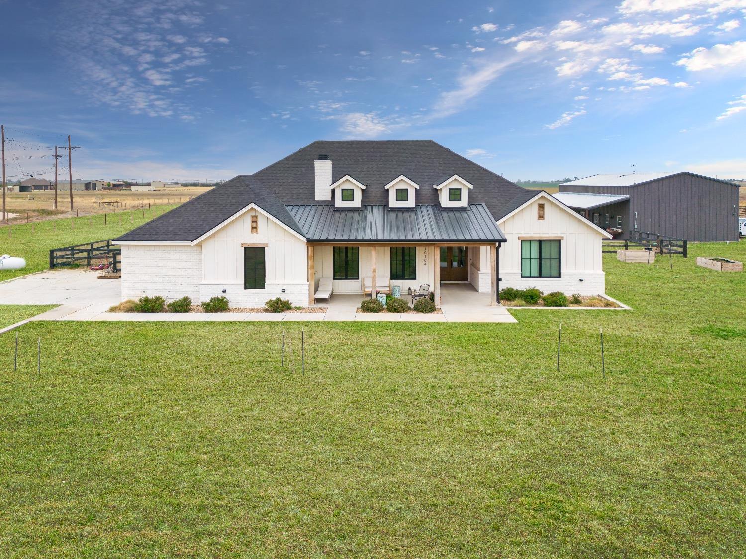 Welcome to your custom luxury farmhouse in Idalou, Texas! This spacious home features a 3,000 square foot main house and 1,400 square foot 2/1 apartment in the shop. A total of 5 bedrooms, 3.5 bathrooms, an office, 3 living areas, oversized 2 car garage and 10 acres to spread out & enjoy the country. The best of finishes include a Z-line black stainless dual fuel range, commercial grade fridge/freezer, floating shelves, hardwood floors throughout, two fireplaces, herringbone brick paver flooring in master closet & laundry, isolated master suite with restored clawfoot tub, an 1,800 square foot shop with a 2 bedroom 1 bathroom apartment with 3 mini-split HVAC units. Built by Toogood Homes, this property offers a side entry garage and a true farmhouse design with a second living room and brick reveal walls and appointments. Irrigation in the front and back yard with a covered patio on the shop. Idalou ISD and just minutes from town. Schedule your showing today!