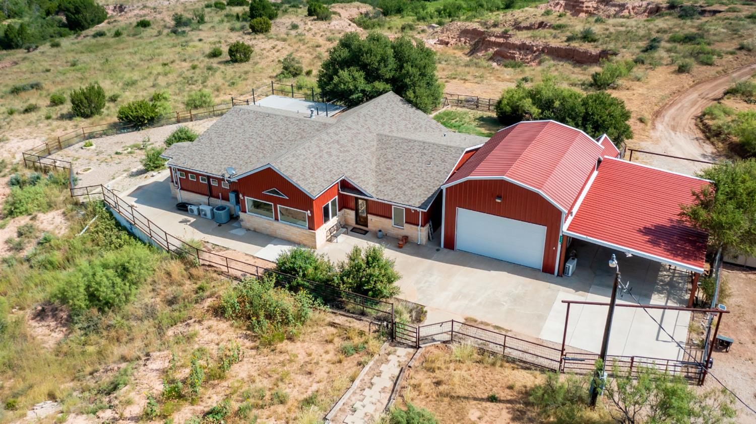 $25K Price Improvement. Welcome to Sand Creek Ranch, an exclusive gated community with just under 1,000 shared acres to enjoy hiking, biking, swimming, & ATV trails. Perfect weekend getaway & only 30 minutes from Texas Tech & medical district. With only 13 members, each member is allowed 2 cows or horses if you wish to own, it is rare for a home like this to come available in this spectacular oasis with incredible views near Lubbock, Texas. 4 a/c units in home to allow zone temperature controls. Main house is one level (handicap friendly). 10-day backup water supply-550 gallon maintains-60 PSI. Fiber internet with 1GB speed. Primary bedroom has separate his & her private bathrooms & closets. Perfect living area for entertaining large numbers of guests with a huge flex room;  can be an office or media room with wet bar & fabulous views. Spacious gourmet chef's kitchen 2 islands open to living room with both casual & formal dining areas & breakfast bar seating overlooking canyon.