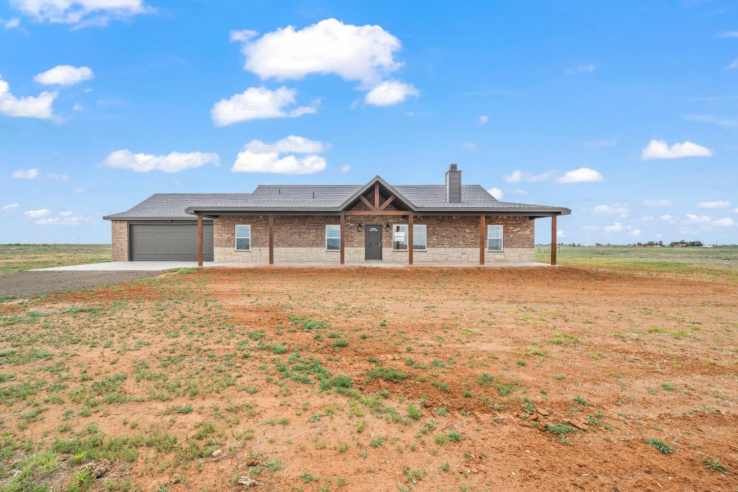 Come see this beautiful new construction home by Blue Creek Homes, LLC! Located in Prestigious Lubbock Cooper ISD, on 10.01 acres. Deed restrictions allow horses. Four bedrooms, Two Bathrooms. This home offers an isolated master suite with walk in shower and Separate tub. Separate Vanities and a walk in closet in the master. Spacious separate laundry room. Granite countertops throughout. New appliances including: Range, microwave, and dishwasher. Vaulted ceiling in living, with fireplace. Spacious bedrooms and closets throughout. Two car Garage with Utility closet. Perimeter barbed wire fence around the ten acres.  No City Taxes! Don't miss out!