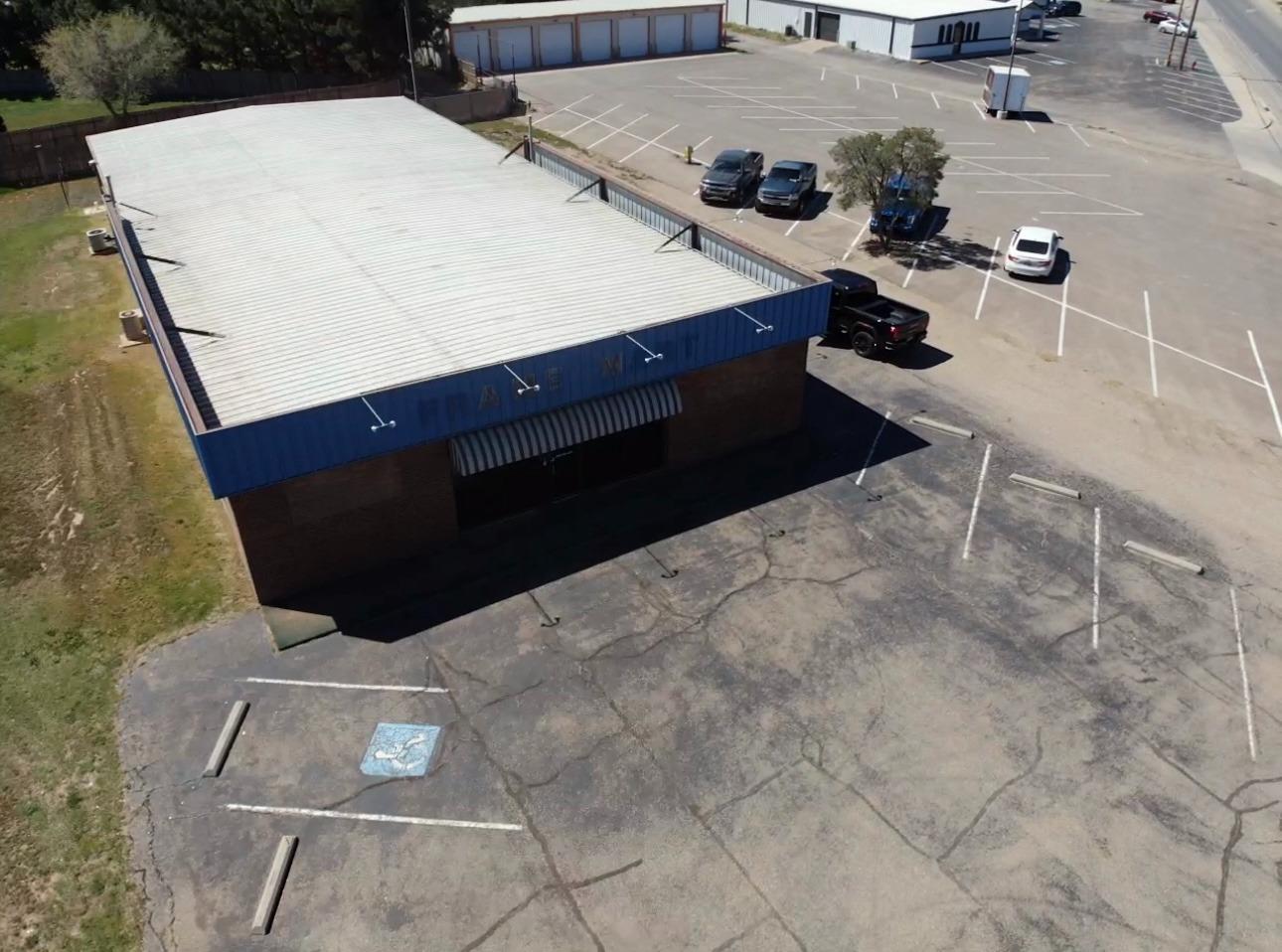 Don't miss your opportunity on this great commercial property ideally located on Marsha Sharp frontage road. You're sure to receive plenty of exposure with this perfect location with a high traffic area. Right down the street from 4ore, this 5500 sq ft building could be the perfect opportunity for your business. This commercial building has a beautiful showroom, along with plenty of work space and storage in the back of the building. Also includes its own well and septic, which will save you big time in the long run!