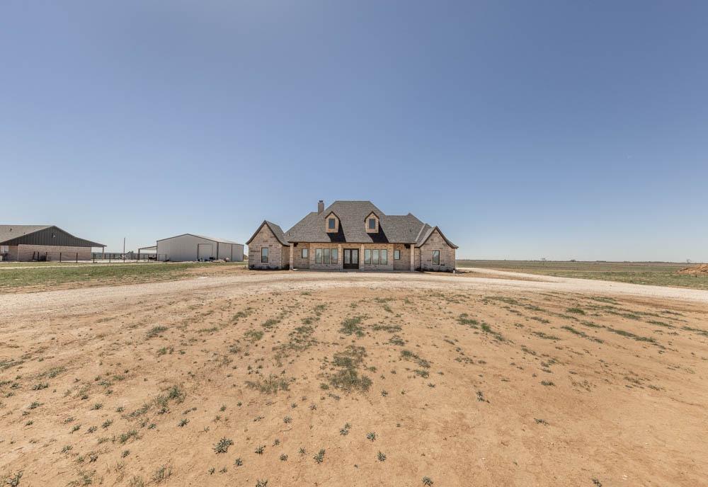 *Seller offering $10,000 in INCENTIVES toward closing cost, rate buy down, etc -- Also, two-year home warranty.* This beautiful 5-bedroom, 5-bathroom home spans 3,378sqft on approximately 2.6 acres. Enter into the grand living area boasting 17-ft ceilings with plenty of space to entertain! Indulge in the primary walk-in bath featuring a soaking tub, and rain shower. Stay productive in the office, or unwind by one of the fireplaces. Entertain effortlessly on the front and back covered patios or in your dream kitchen that offers smart stainless steel appliances, quartz countertops, and a blend of modern black fixtures. Enjoy luxury vinyl plank flooring throughout with plush carpet in the bedrooms. Find solitude in the isolated primary suite or the upstairs 5th bedroom, perfect as a mother-in-law suite, guest room, or game/media room. Additional highlights include custom wood soft-close cabinetry, private well, oversized garage with extended concrete pad, and a circular rock driveway.